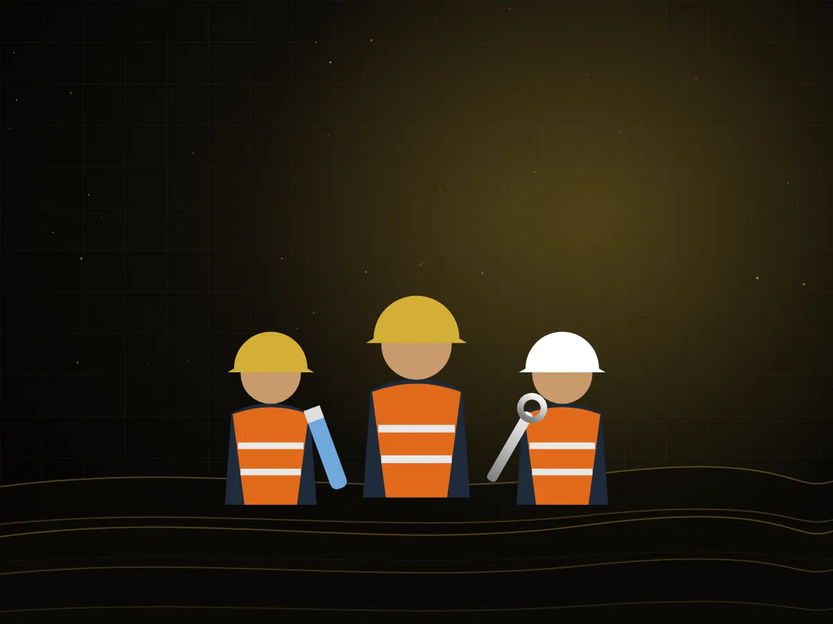 Engineer and technicians in hard hats and safety vests